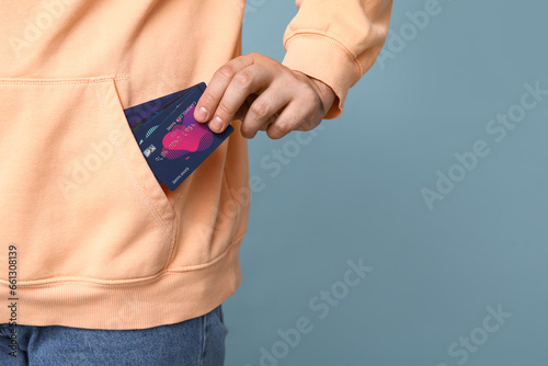 Young man with credit cards...