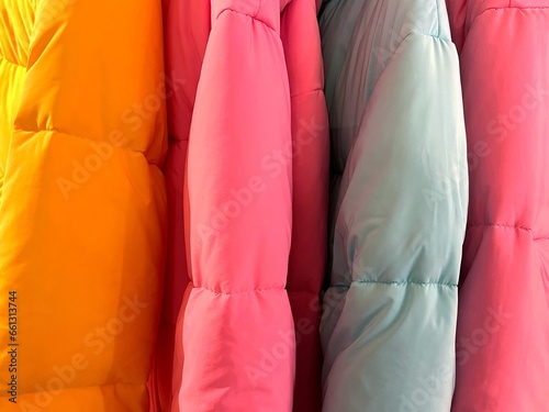 Jackets warm colorful clothing on a hanger.