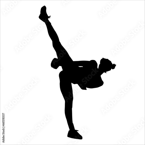 Silhouette of a slim female doing martial art pose. Silhouette of a martial art woman in action pose.