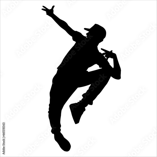 Silhouette of a male dancer in performing pose. Silhouette of a dancing man.