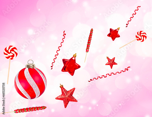 Christmas decorations on a pink background with bokeh. Levitation