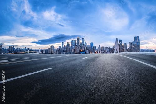 Chongqing asphalt road and city financial district skyline at dusk