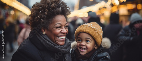 black grandmother and her grandchild at a christmas market photo
