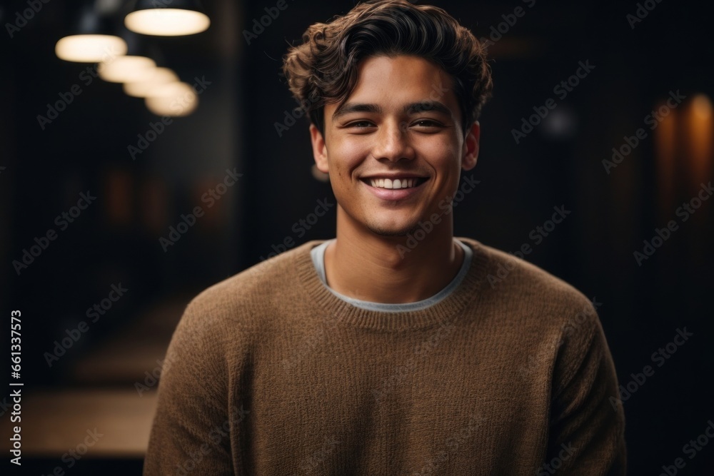 Fototapeta premium portrait of a handsome man smiling with mock up shirt and studio background