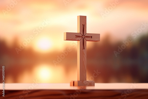 Defocused Christian wooden cross at sunset