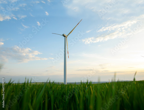 Windmill turbine generating green energy electric.
