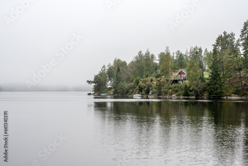 Lake Ragnerudssjoen in Dalsland Sweden beautiful nature forest pinetree swedish houses photo