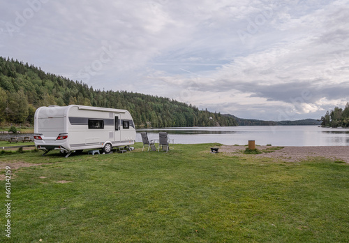 campsite camping caravan by lake Ragnerudssjoen in Dalsland Sweden beautiful nature forest pinetree