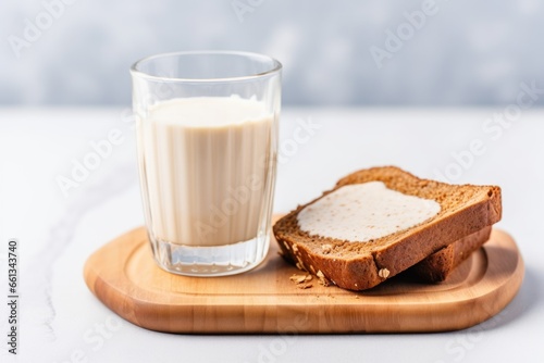 toast with melted almond butter and a glass of milk photo