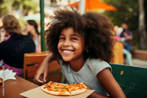 happy african american girl sitting with pizza