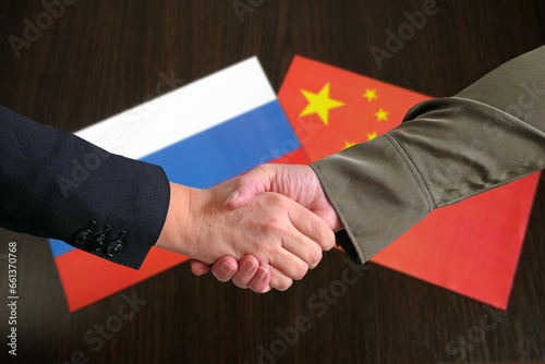 Photography handshake against the background of the Russia and China, friendship and partner