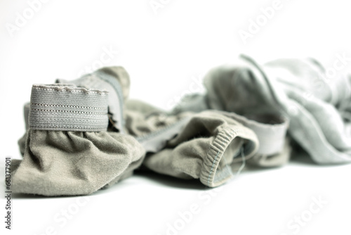 The old and tear man underwear for men on white background. Close up