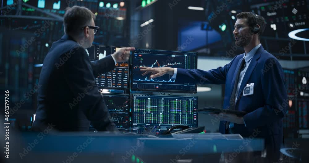 Two Successful Traders Analyzing Real-Time Financial Data and Reports About the State of the Finance Market. Stock Exchange Professionals Discussing Buy and Sell Options For Different Bonds