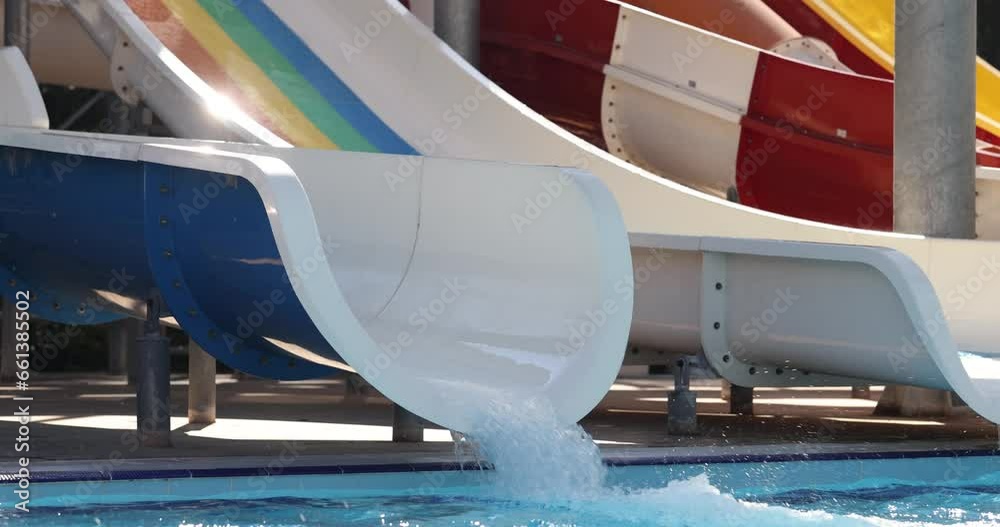 Amusement park with water slides and swimming pool. Conceptual sports, leisure and travel and fun water Amusement park with water slides and swimming pool. Conceptual sports, leisure and travel and fun water
