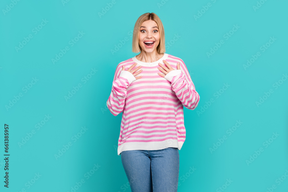 Photo of impressed funky lady wear pink pullover arms chest open mouth isolated turquoise color background Photo of impressed funky lady wear pink pullover arms chest open mouth isolated turquoise color background