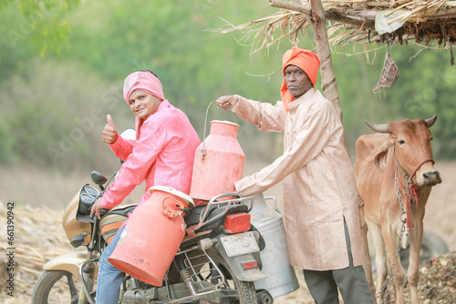 Indian farmer selling milk on bike