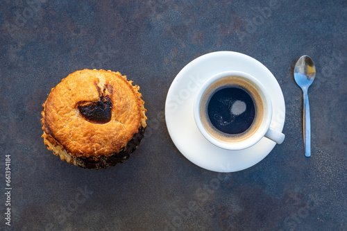 Overhead shot of a Mattentaart sweet cake and a coffee, Geraardsbergen, Flemish Region, Belgium photo