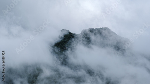Mountain peak of Doi Luang Chiang Dao mountain hills in Chiang Mai, Thailand. Nature landscape in travel trips and vacations. Doi Lhung Chiang Dao Viewpoint with mist and fog during rain season