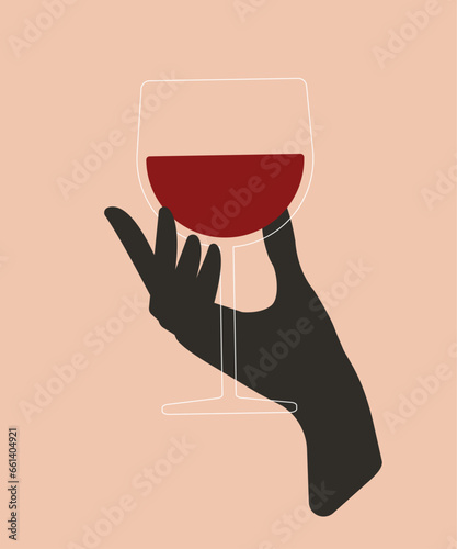 Hand holding a wine glass
