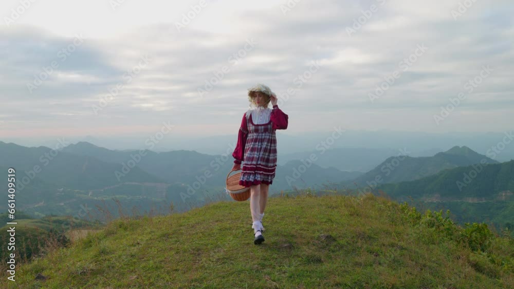 female caucasian blonde model in old fashioned traditional European clothing walking alone in mountains landscape slow motion female caucasian blonde model in old fashioned traditional European clothing walking alone in mountains landscape slow motion