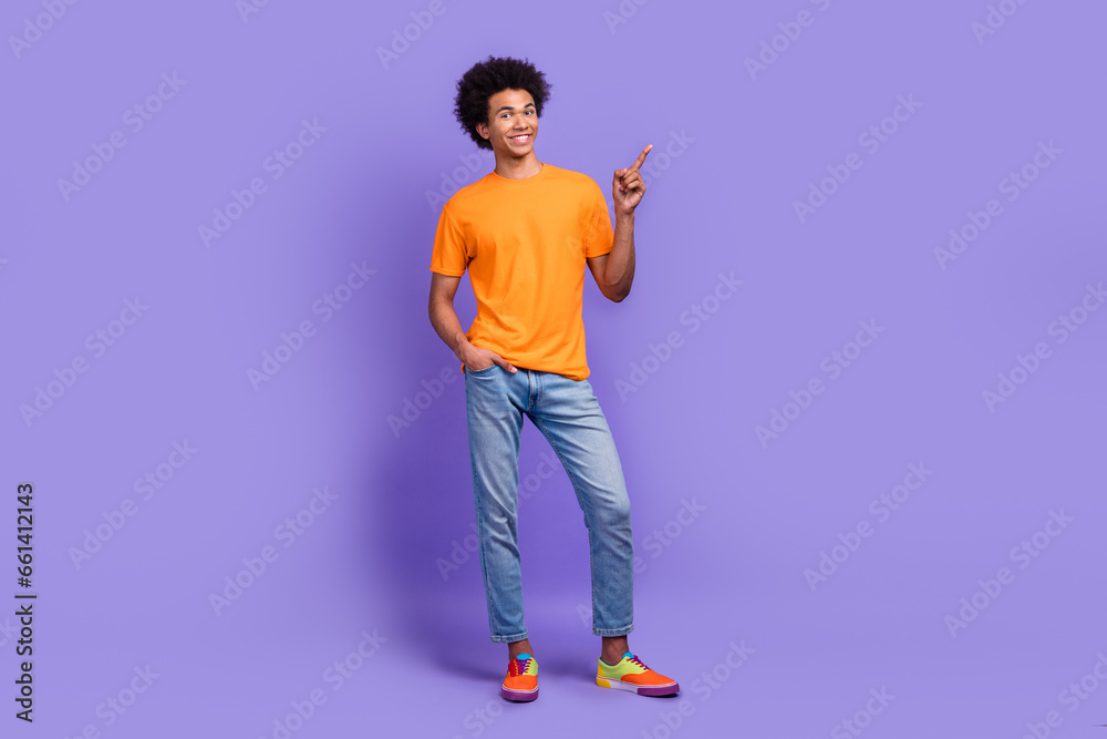 Full body size photo of confident marketing promo manager hipster guy funny hair direct finger mockup isolated on violet color background Full body size photo of confident marketing promo manager hipster guy funny hair direct finger mockup isolated on violet color background