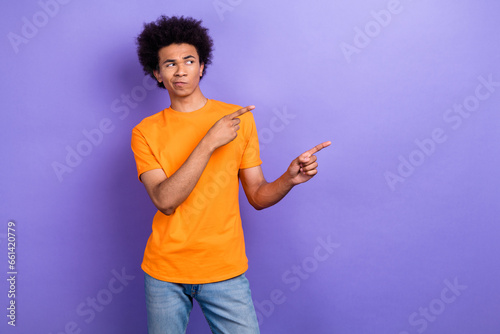 Photo of minded person look indicate fingers empty space hesitate isolated on violet color background