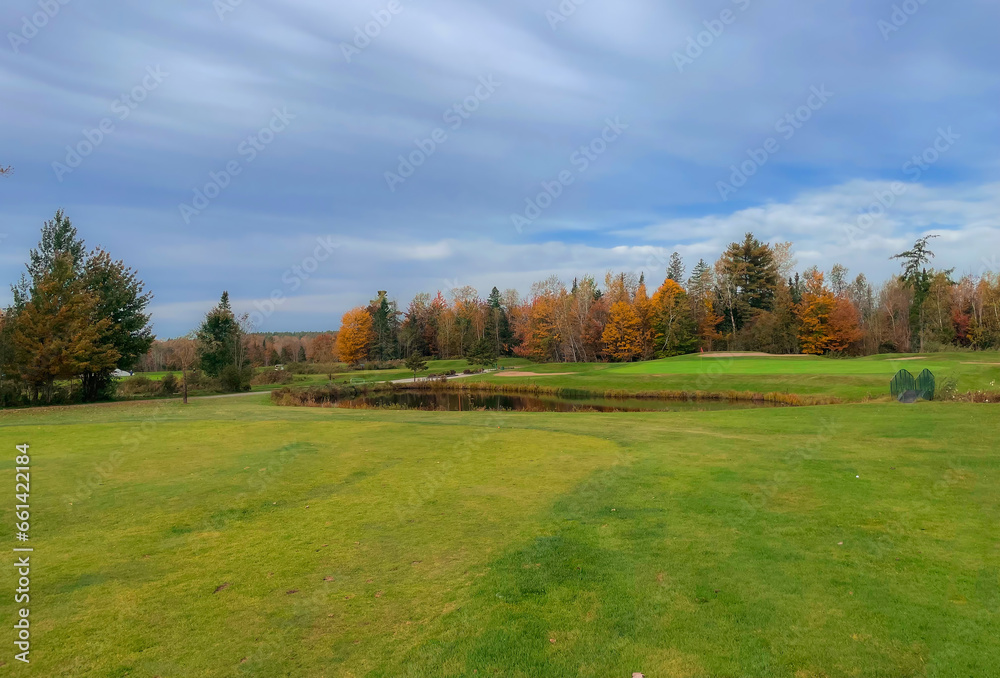 Nice hole on a Canadian golf club in Quebec in fall, on the countryside