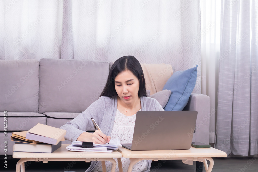 Asian stress headache female worried working at home calculate income and paying tax declarations using modern technology laptop, unsecured poor planning of single woman financial crisis or house loan Asian stress headache female worried working at home calculate income and paying tax declarations using modern technology laptop, unsecured poor planning of single woman financial crisis or house loan