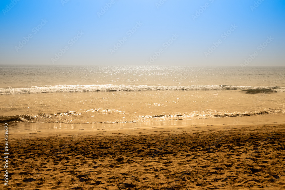 Beach and ocean waves in golden and blue tones in Gran Canaria, Spain Beach and ocean waves in golden and blue tones in Gran Canaria, Spain