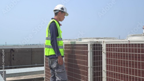 Wallpaper Mural Worker technician check of outdoor fan air conditioner on the roof top industry building. The footage is suitable to use for maintenance advertising and worker content media. Torontodigital.ca