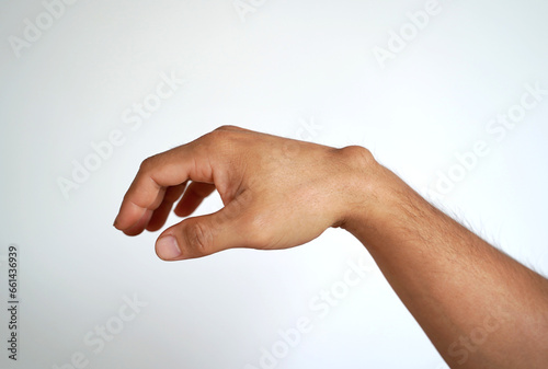 Ganglion cyst on man's hand on white background photo