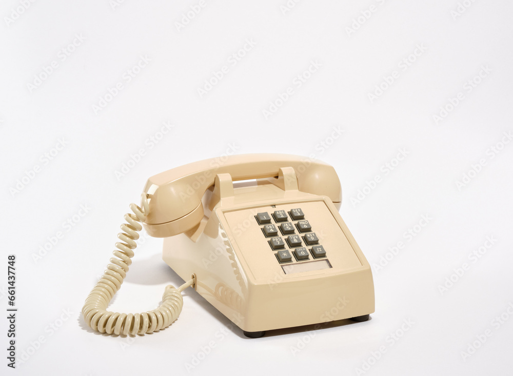 Retro beige phone on the table. Old style telephone. Retro beige phone on the table. Old style telephone.