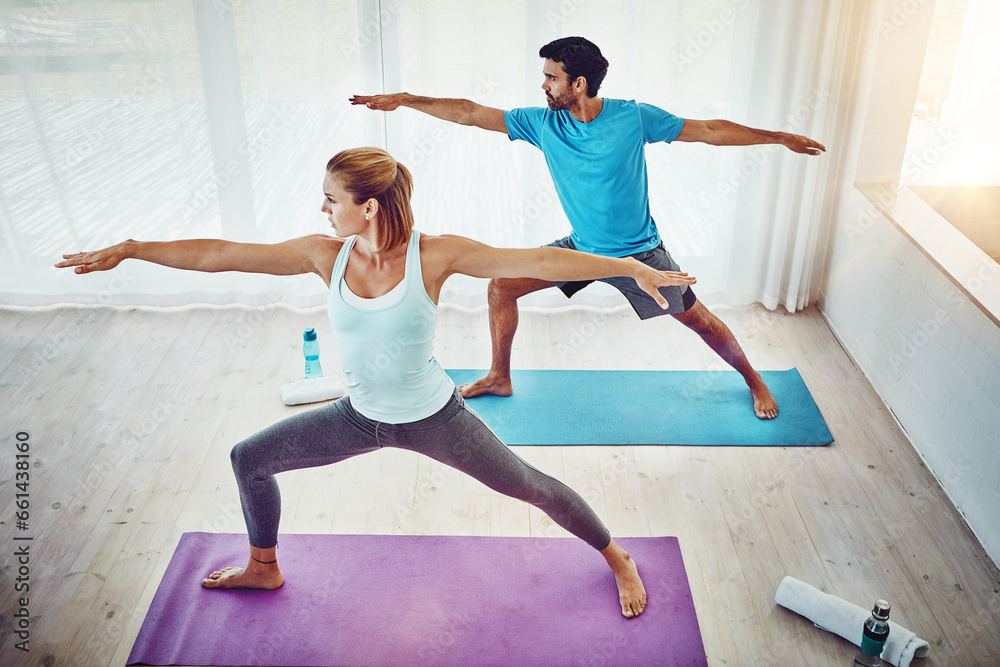 Couple, yoga and stretching in home or studio fitness, exercise and holistic training, teamwork or training. People or personal trainer in warrior pose for balance, mindfulness and workout together