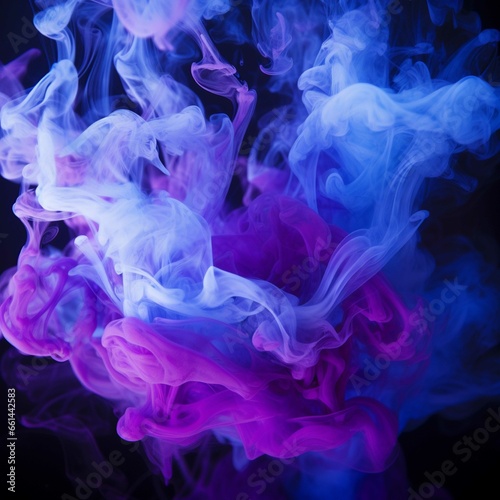 Purple and blue ink in water on a black background. Abstract background.