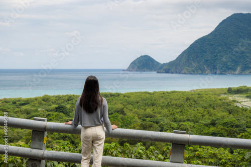 Woman look at the sea with mountain