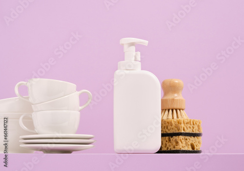 Set of clean tableware and washing dishes in the kitchen. Idea of housework and hygiene.