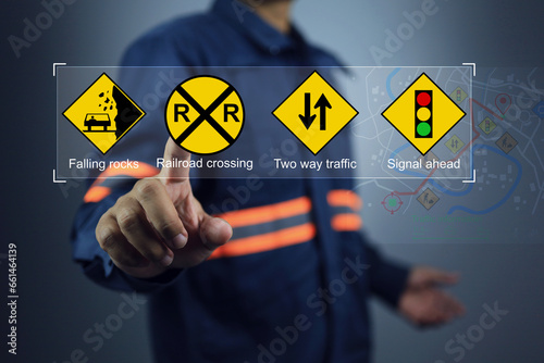 Engineer or safety staff pointing on warning sign to encourage driver to pay more careful when traveling on road and dangerous area. Respect law to reduce accident.