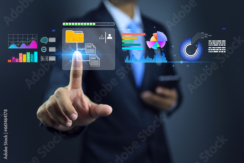 Data document management concept. Businessman downloading business file and folder information from internet cloud servers to apply on business strategy planning or research to start new products