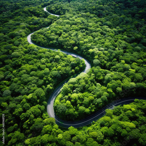 Aerial view of a mountain road in the form of a heart through a forest landscape