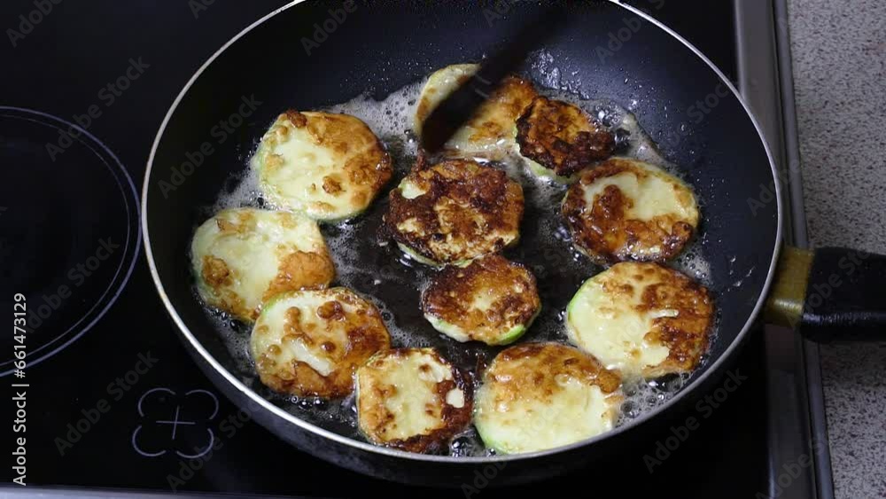 Video recipe for cooking zucchini fried in batter. Part 8. Frying zucchini slices in batter in a frying pan. Video recipe for cooking zucchini fried in batter. Part 8. Frying zucchini slices in batter in a frying pan.