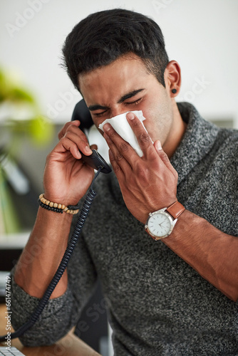 Phone call, sneeze and blowing nose with a man using a tissue closeup in a home for relief from allergy symptoms. Sick, cold or influenza and a person talking with a virus due to pollen or hay fever