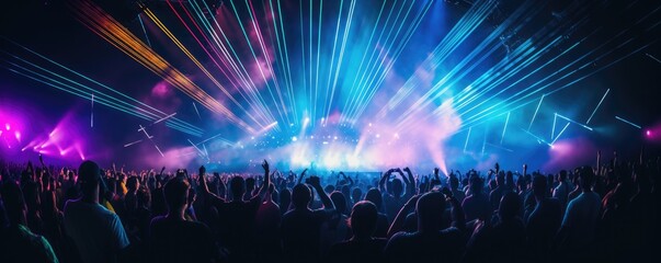 Silhouette of a crowd cheering at a large concert