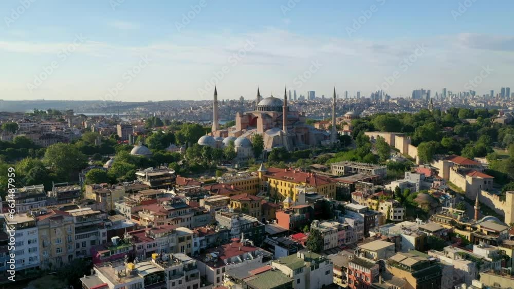 4k aerial view of the Hagia Sophia (Ayasofya) Mosque, one of the important buildings of the city on the European side. City center from above on a sunny day. Hagia Sophia, Istanbul, Turkey.