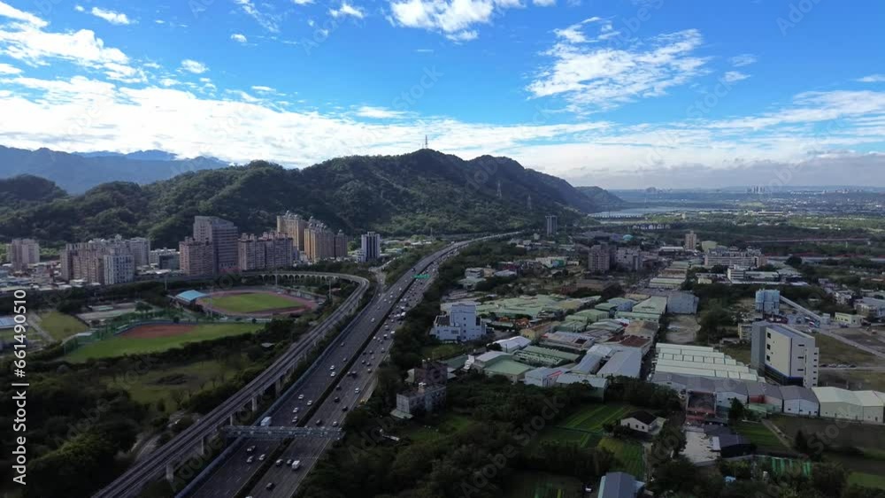 Aerial 4K video view of cars passing on a highway in Sanxia district, Taiwan. Aerial 4K video view of cars passing on a highway in Sanxia district, Taiwan.
