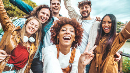 Big group of friends taking selfie picture smiling at camera - Laughing young people celebrating standing outside and having fun - Portrait photography of teens guys and girls enjoying vacation