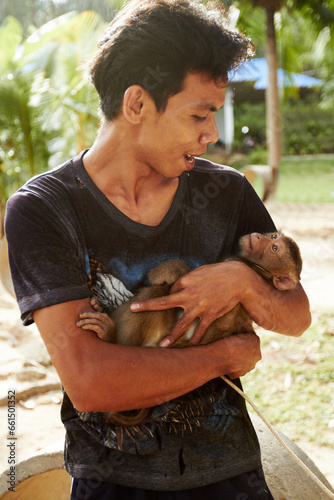 Photography Zoo, animal and man with monkey in nature for care, conservation and wildlife rescue