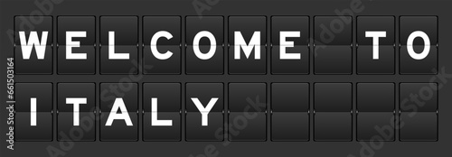 Black color analog flip board with word welcome to italy on gray background