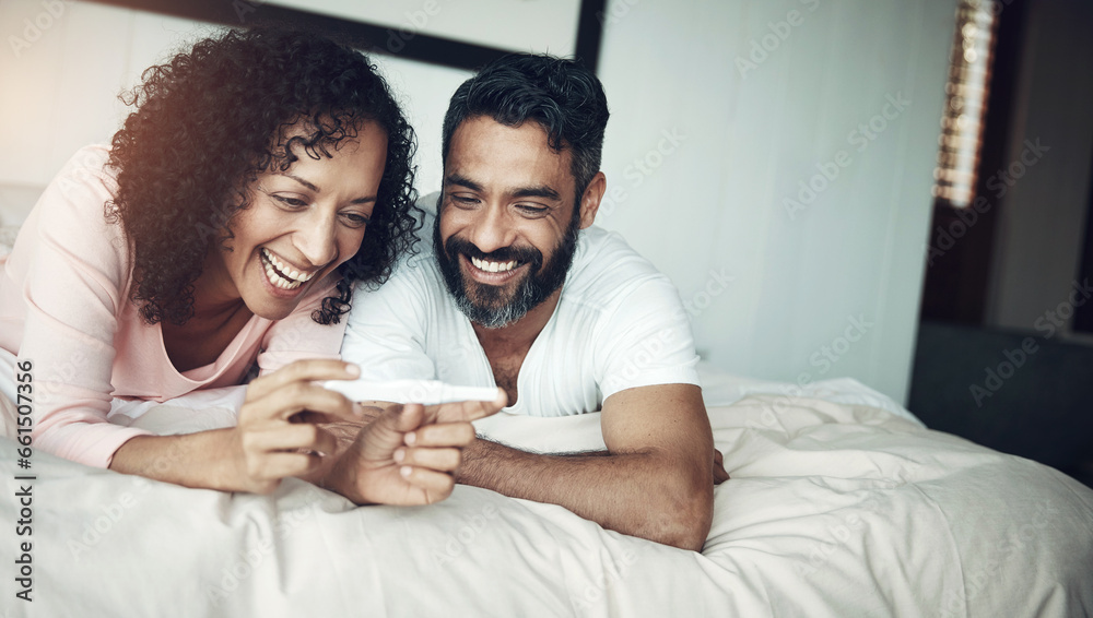 Couple, happy and bedroom with pregnancy test, positive and bed with smile, results and excited. Man, woman and baby with stick, love and maternity for future family, surprise and pregnant together Couple, happy and bedroom with pregnancy test, positive and bed with smile, results and excited. Man, woman and baby with stick, love and maternity for future family, surprise and pregnant together