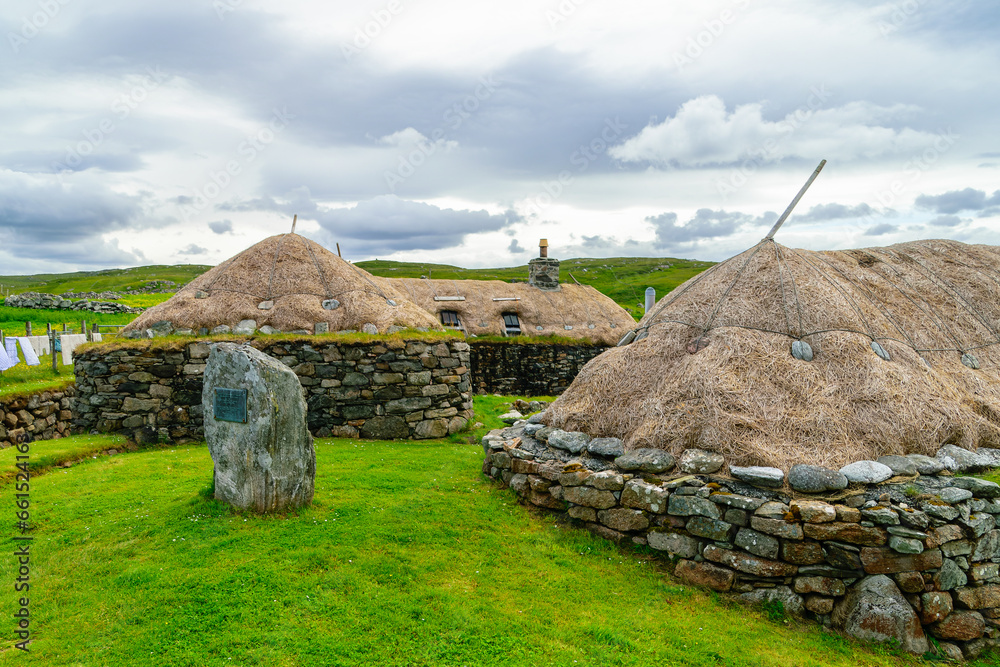 Gearrannan Black House Village on a Sunny Day with Clouds in the Sky (Dun Carloway, Isle of Lewis, Scotland)