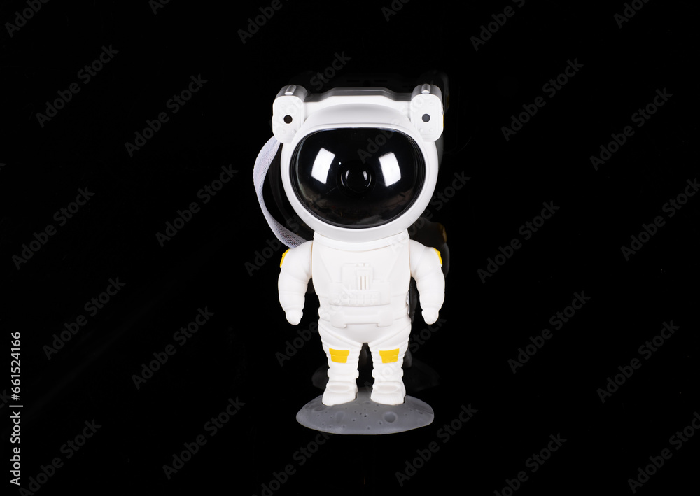 Fototapeta premium astronaut toy isolated on black background